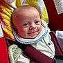 baby, smiling, car_seat, blanket, towel, red, yellow, white, straps, clothing, infant, cute, face, head, child, sitting, portrait, happy, indoors, closeup