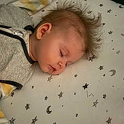 Elaina joined the competition — help win amazing prizes! baby, sleeping, crib, bedding, stars, moon, pattern, infant, face, hair, peaceful, child, cute, portrait, rest, bed, pajamas, hand, soft, indoors