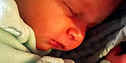 Elaina is registered to the contest to win money with this photo: newborn, baby, sleeping, closeup, infant, blanket, soft, peaceful, face, skin, child, indoors, cozy, cute, small, rest, portrait, warmth, clothing, hand