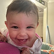 Kaliana is registered to the contest to win money with this photo: baby, child, infant, smiling, laughing, portrait, face, eyes, hair, indoor, home, cushion, blanket, clothing, bib, playmat, welcome_sign, mop, warm_lighting, happy
