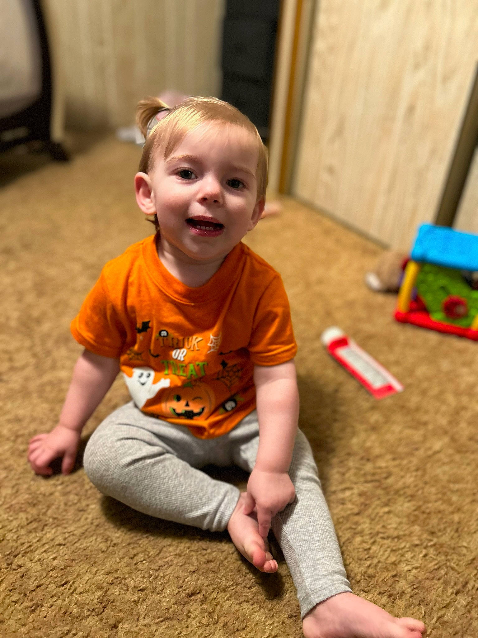 Brielle joined the competition — help win amazing prizes! baby, baby_toddler_clothing, child, chin, face, floor, flooring, fun, grass, happy, head, human_body, leisure, person, sitting, skin, smile, standing, t_shirt, toddler
