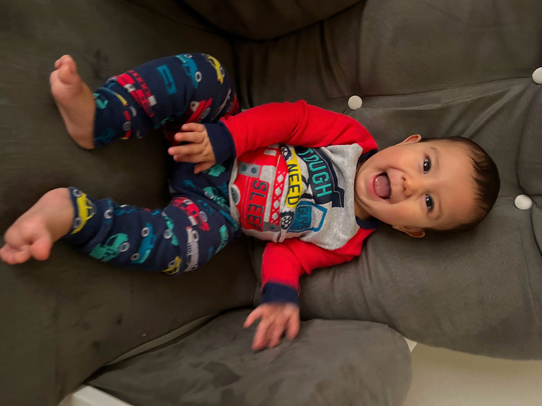 Joshua is registered to the contest to win money with this photo: baby, baby_toddler_clothing, carmine, child, comfort, elbow, facial_expression, flash_photography, floor, flooring, foot, fun, human_leg, person, room, sitting, skin, sleeve, sock, toddler