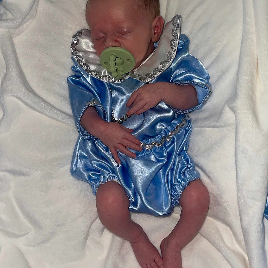 James joined the competition — help win amazing prizes! architecture, baby, bed, bedroom, blanket, building, cushion, face, furniture, head, homedecor, hospital, indoors, newborn, person, photography, portrait, quilt, room, sleeping