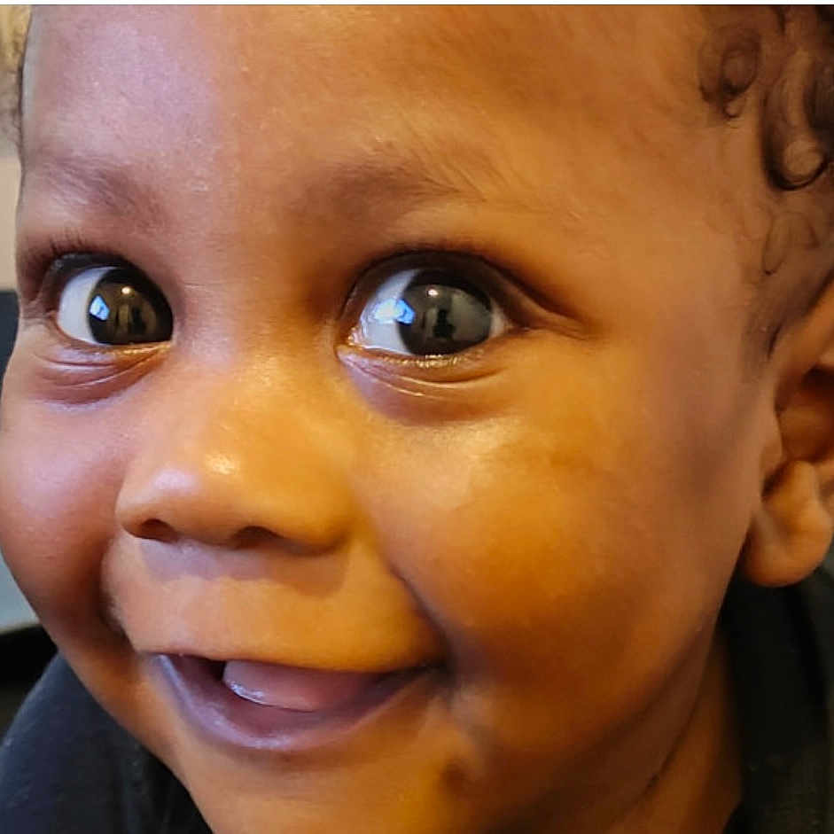 Tymir joined the competition — help win amazing prizes! baby, child, face, smile, eyes, close_up, joy, expression, portrait, cute, innocence, happy, skin, head, person, human, cheeks, curly_hair, young, emotion