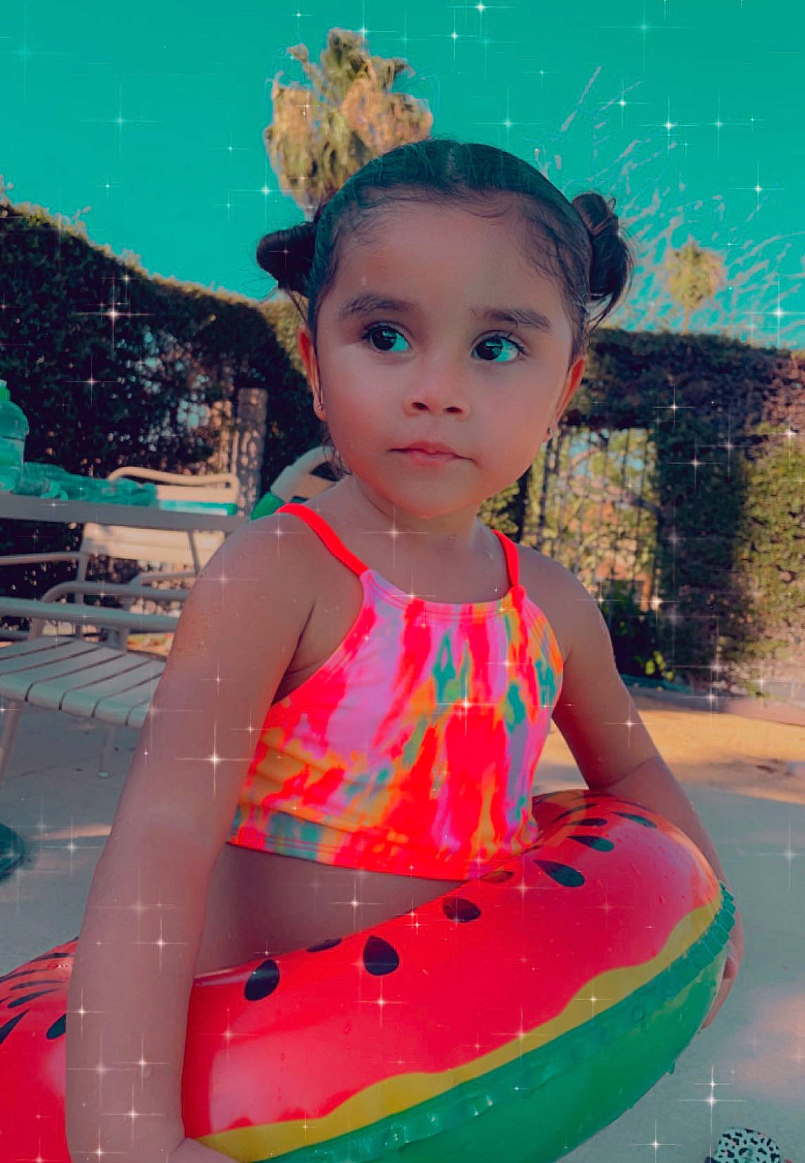 Liana is registered to the contest to win money with this photo: aqua, bathing, child, face, fun, happy, leisure, magenta, organ, people_in_nature, person, personal_protective_equipment, pink, play, recreation, summer, swimming_pool, tiara, toddler, vacation