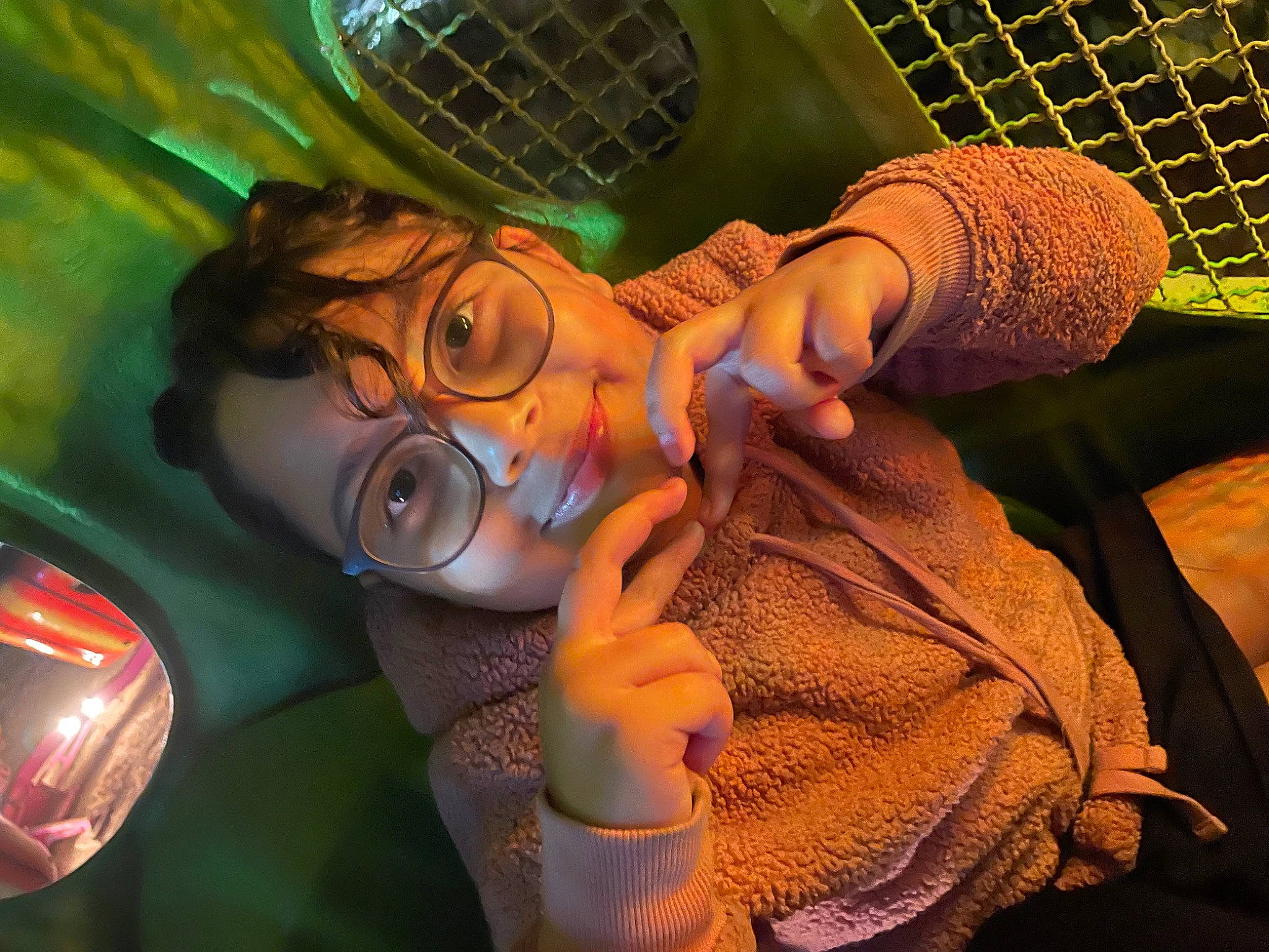 Melanie is registered to the contest to win money with this photo: automotive_lighting, child, event, eyewear, finger, fun, gesture, glass, hand, happy, leisure, light, mesh, mouth, nail, pattern, person, personal_protective_equipment, thumb, wrist