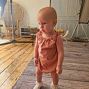 Aurora joined the competition — help win amazing prizes! toddler, child, baby, romper, socks, standing, wooden_floor, studio, photography_lighting, chair, vintage_decor, curious, indoor, bracelet, floor_mat, person, cute, portrait, expression, room