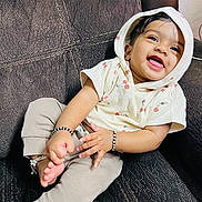 Arha joined the competition — help win amazing prizes! baby, child, smile, hoodie, cherry_print, bracelet, anklet, couch, sitting, happy, cute, clothing, person, indoors, portrait, infant, skin, hand, foot, jewelry