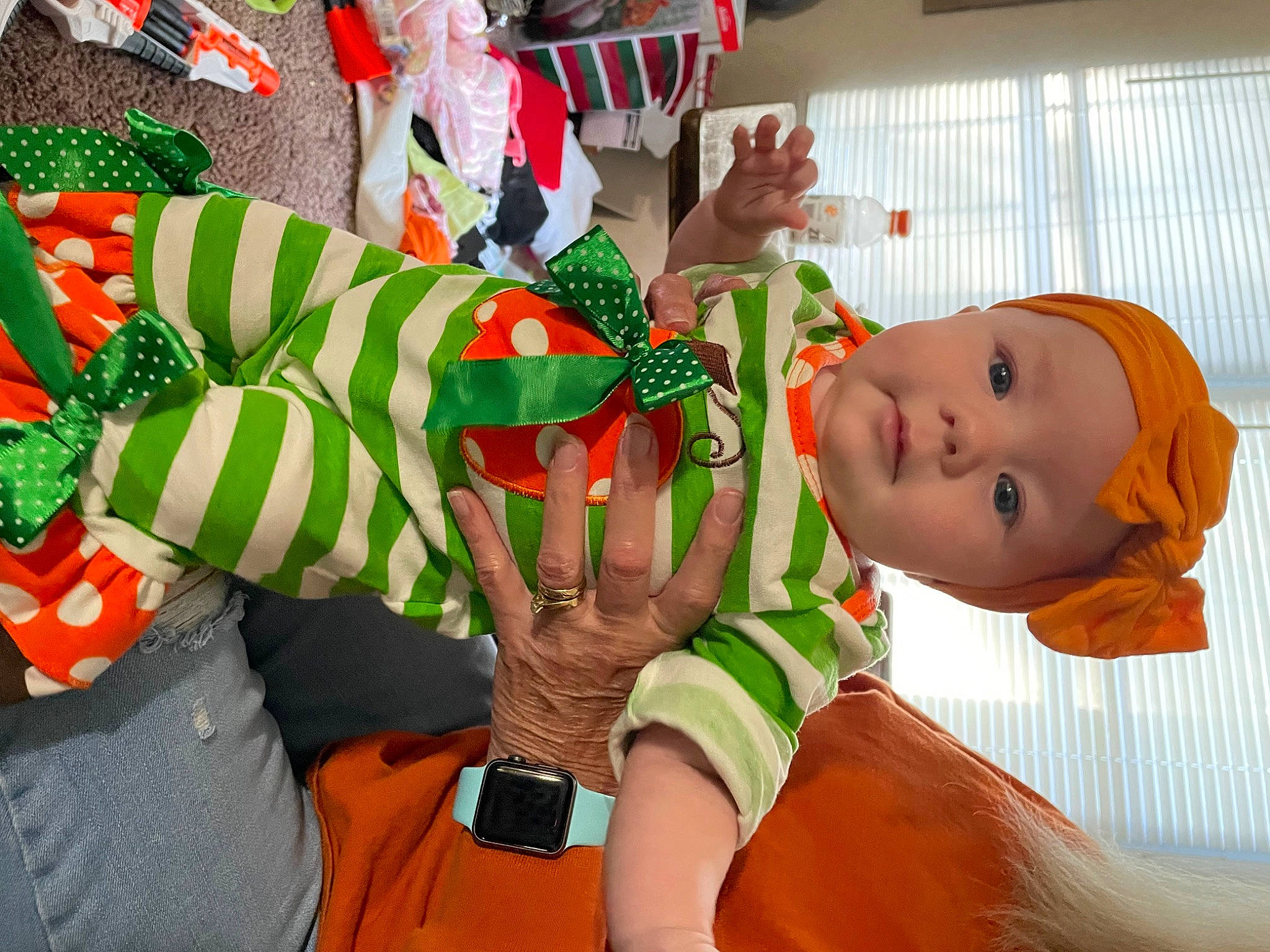 Lillie is registered to the contest to win money with this photo: baby, carmine, child, christmas, christmas_eve, costume, event, fictional_character, fun, happy, headwear, holiday, leisure, orange, organism, person, play, room, stuffed_toy, toddler