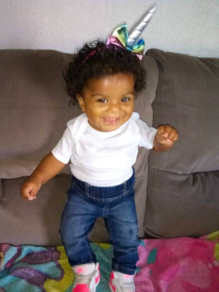 Genesis joined the competition — help win amazing prizes! baby_toddler_clothing, comfort, costume_hat, couch, electric_blue, eye, finger, fun, happy, human_body, jeans, joy, party_hat, person, product, purple, sitting, sleeve, smile, sock