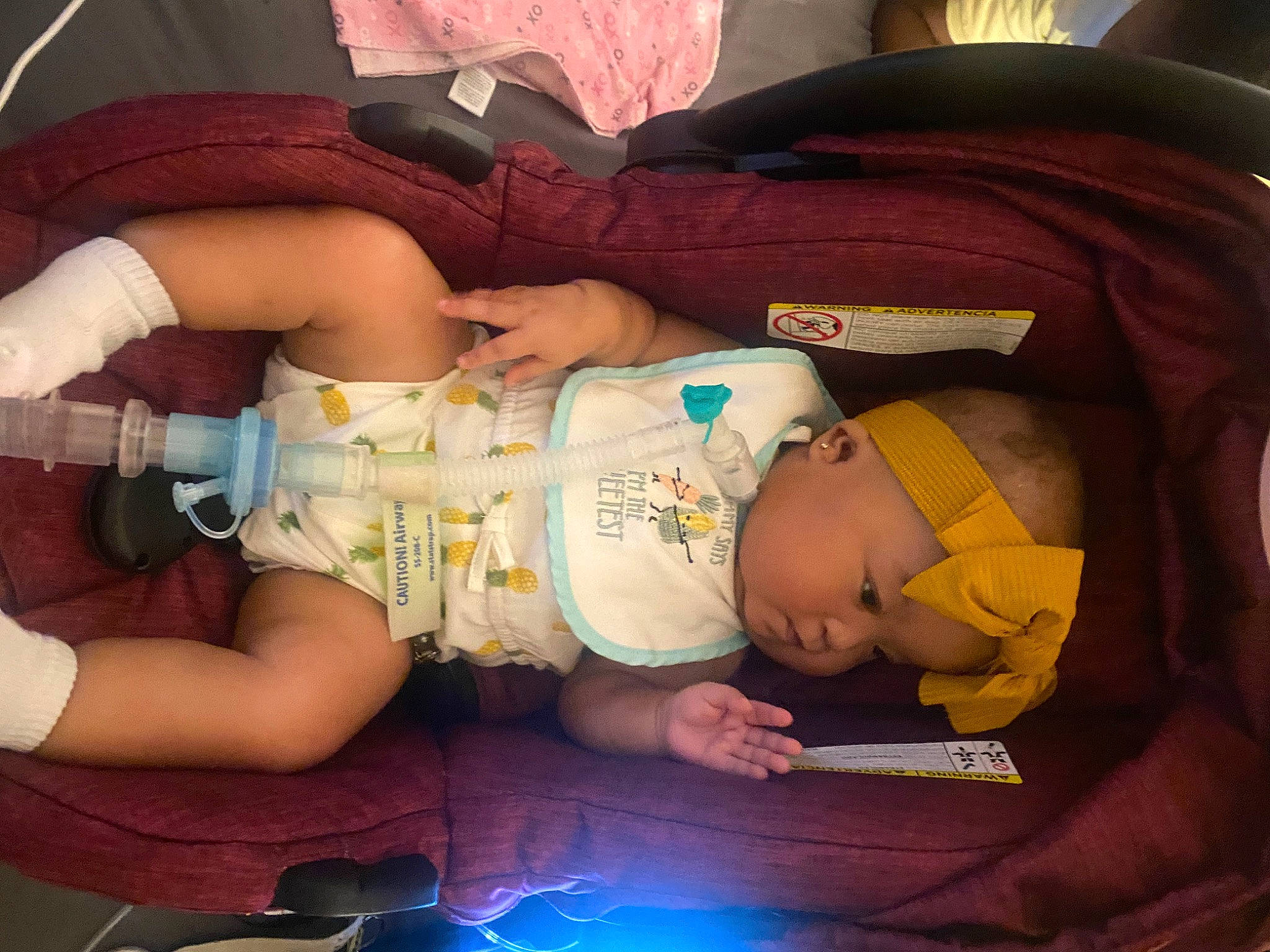 Khalani is registered to the contest to win money with this photo: baby, baby_carriage, baby_products, baby_sleeping, baby_toddler_clothing, cheek, child, comfort, elbow, fun, headwear, human_body, human_leg, lap, leg, mouth, person, product, sitting, thigh