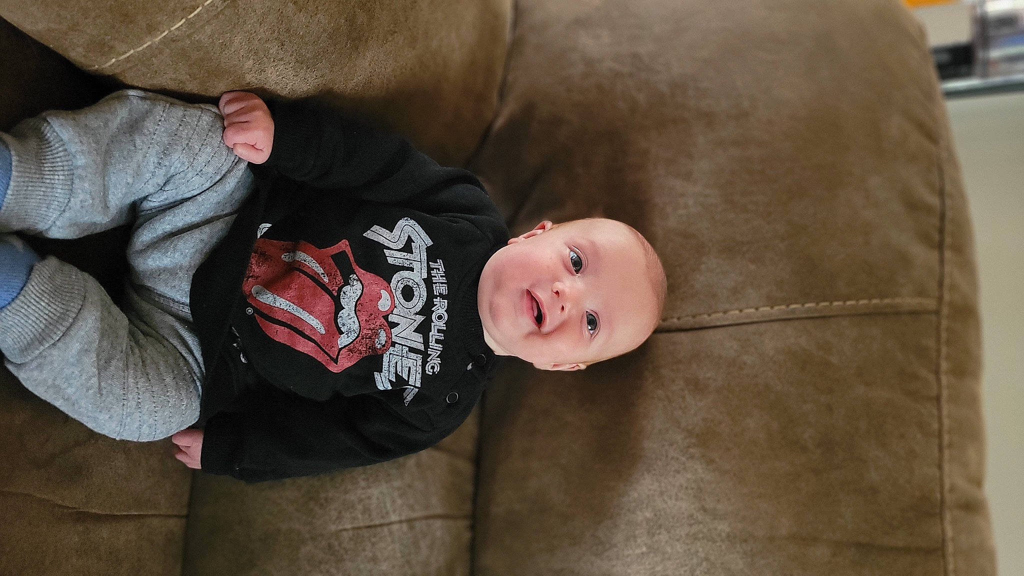 Briar is registered to the contest to win money with this photo: baby, baby_products, baby_toddler_clothing, cheek, child, comfort, couch, fur, linens, person, room, sitting, skin, sleeve, smile, toddler, tree, wood