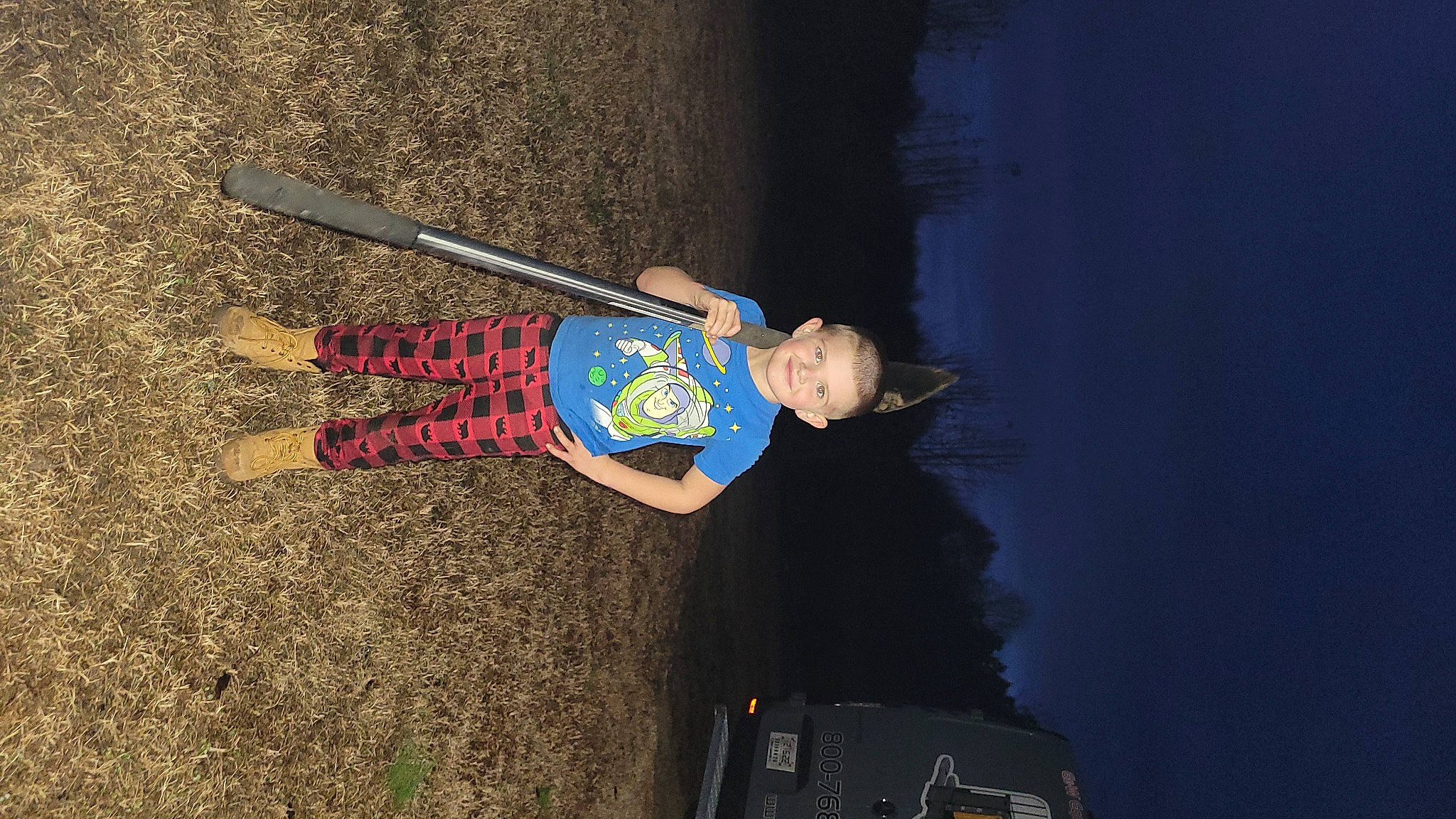 Blaine is registered to the contest to win money with this photo: baseball_bat, child, electric_blue, flash_photography, fun, joy, leisure, luggage_and_bags, person, recreation, rope, shadow, smile, soil, sports, sports_equipment, toddler