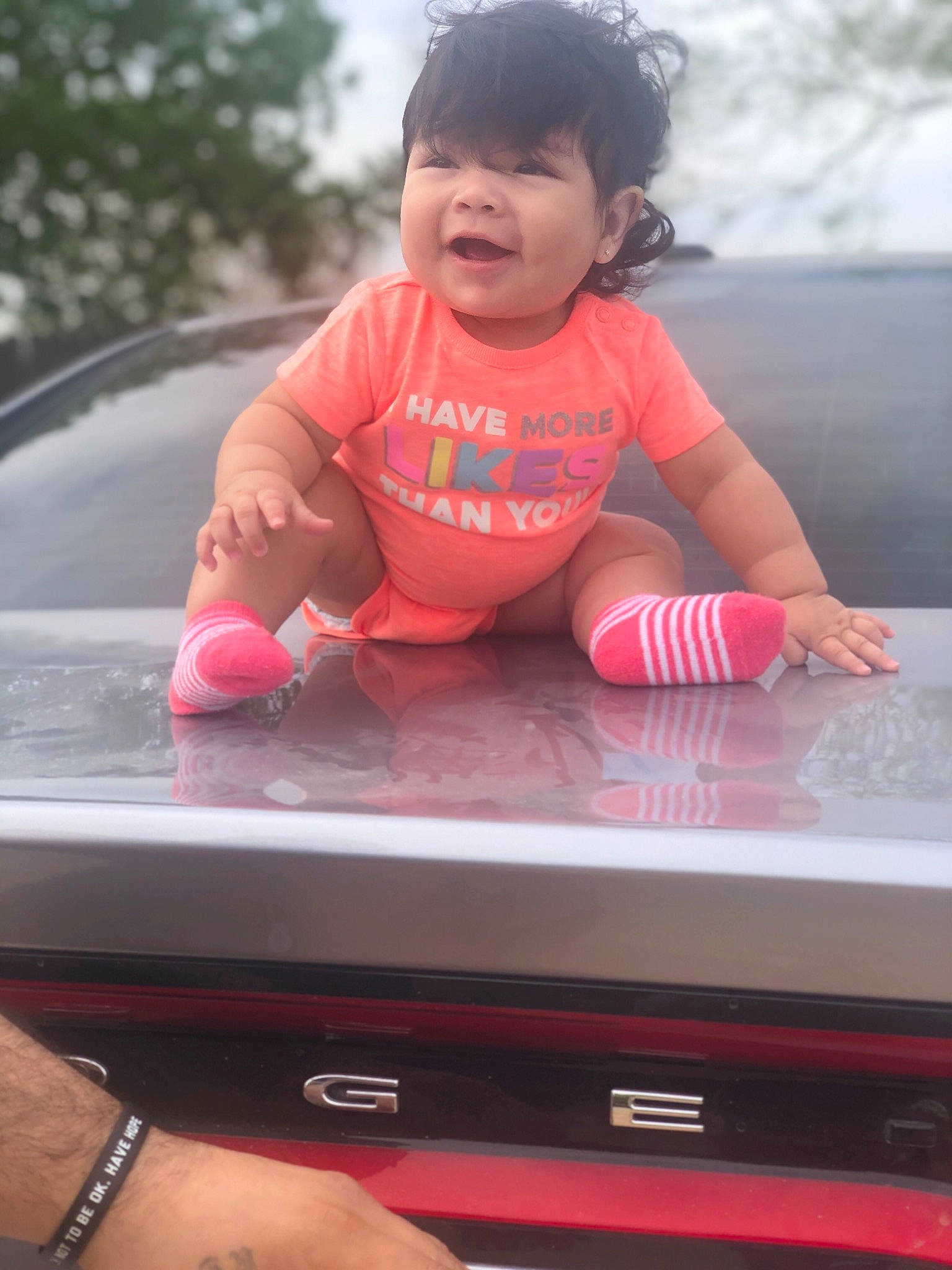 Evelina is registered to the contest to win money with this photo: baby, child, electronic_device, finger, fun, hand, leisure, person, pink, play, skin, smile, technology, toddler, vacation