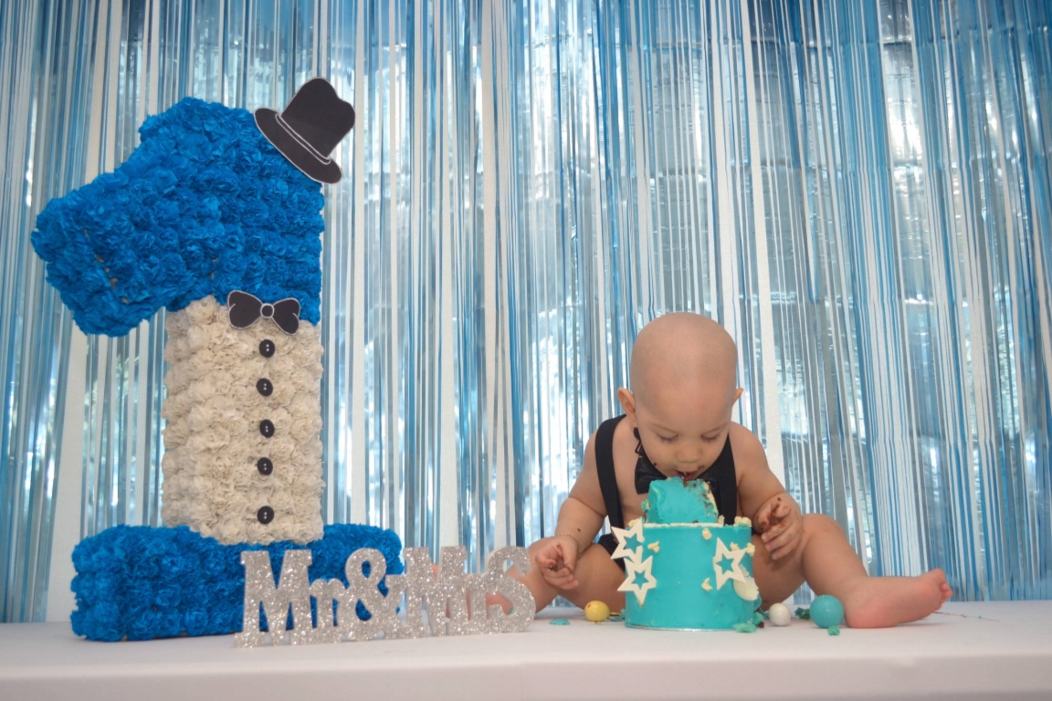 Bryan is registered to the contest to win money with this photo: aqua, art, azure, baby, blue, child, design, electric_blue, flooring, fun, happy, leisure, pattern, people_in_nature, person, recreation, room, textile, toddler, wood