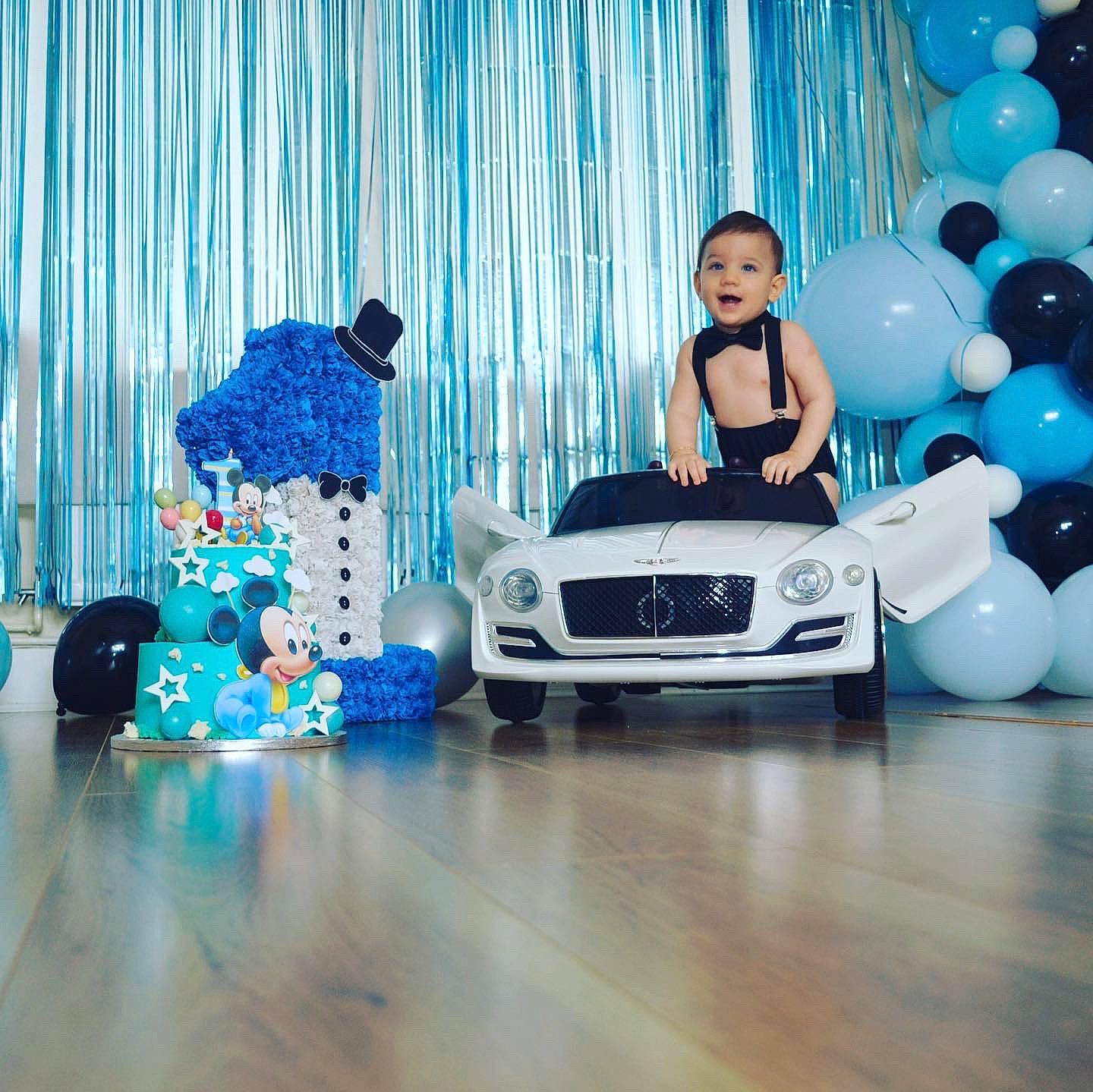 Bryan is registered to the contest to win money with this photo: automotive_design, automotive_exterior, automotive_wheel_system, balloon, blue, bumper, car, electric_blue, entertainment, event, flooring, font, grille, headlamp, hood, motor_vehicle, person, personal_luxury_car, rim, vehicle