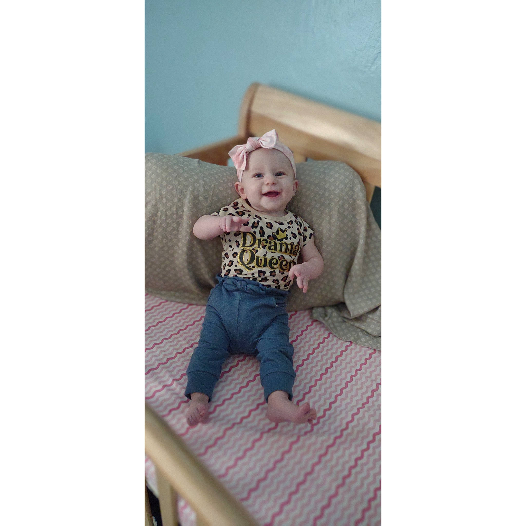 Lucy joined the competition — help win amazing prizes! baby, baby_products, baby_toddler_clothing, comfort, face, grey, hand, happy, headwear, human_body, joy, leg, linens, magenta, pattern, person, shirt, shorts, sleeve, smile