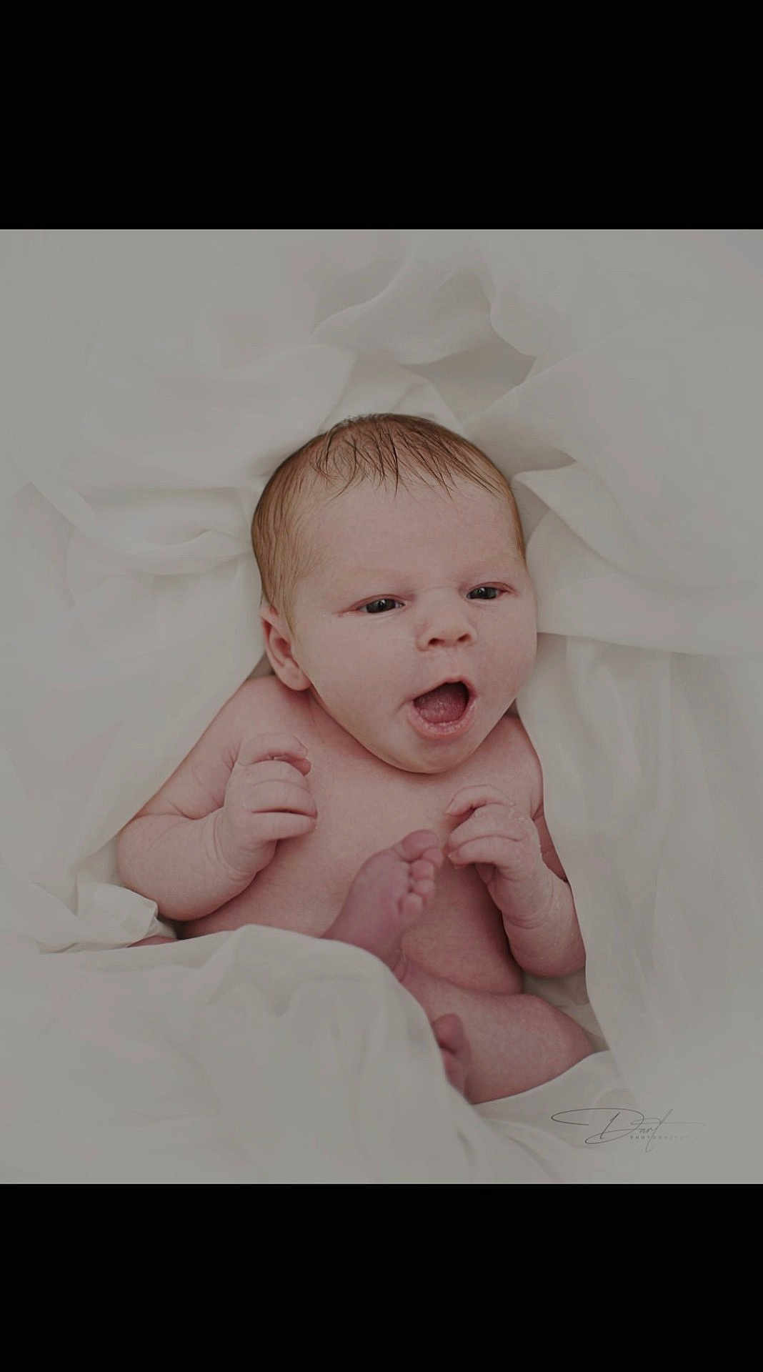 Ensley is registered to the contest to win money with this photo: baby, newborn, infant, skin, hands, feet, white_fabric, soft, cute, portrait, lying_down, expression, face, mouth_open, small, delicate, human, child, sleepy, peaceful