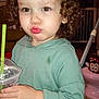 Ellianna is registered to the contest to win money with this photo: brown_eyes, carpet, child, clothing, cup, curly_hair, cute, expression, face, green_hair_clip, green_sweater, hand, indoor, minnie_mouse, potty_seat, pout, sitting, straw, toddler, toy