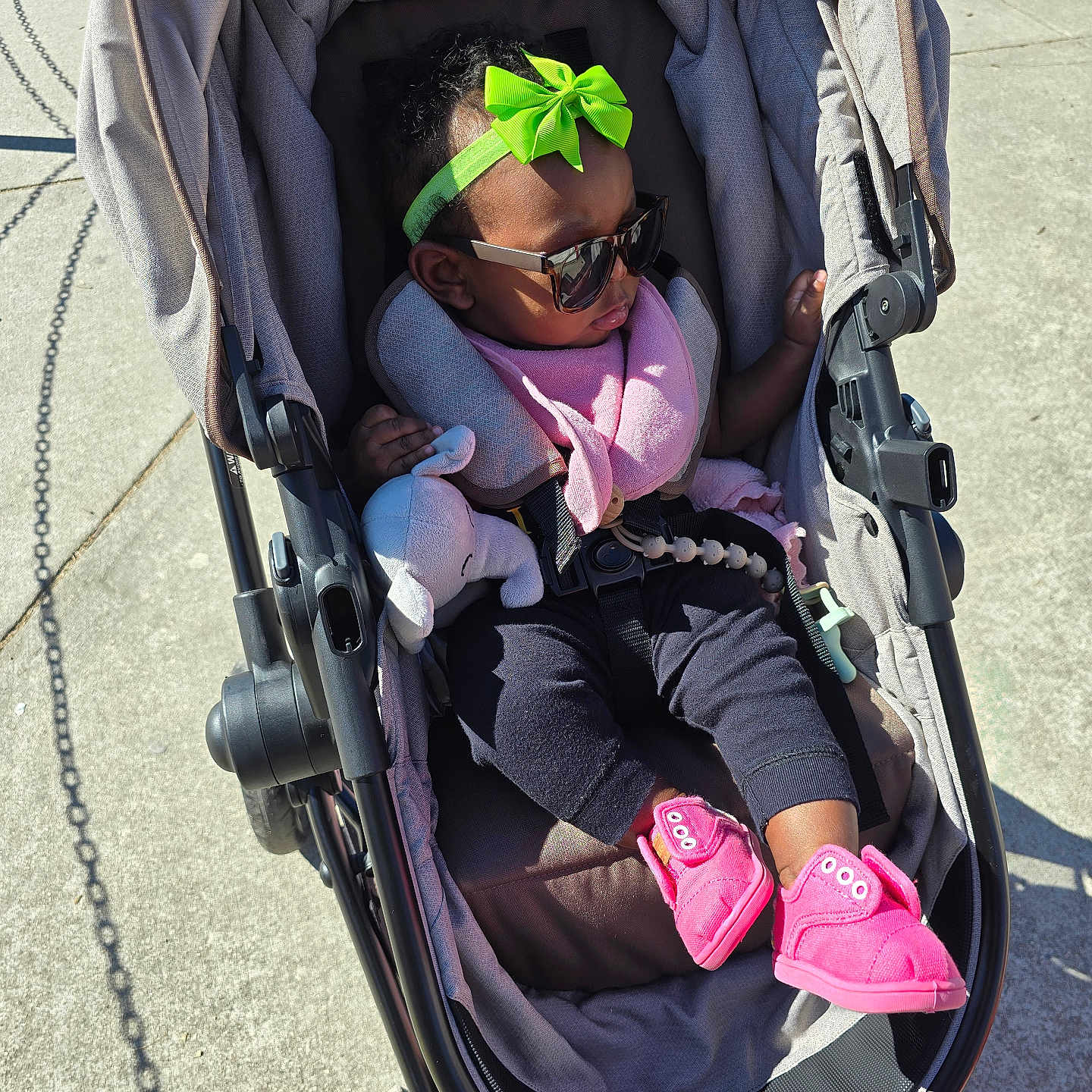 Naomi is registered to the contest to win money with this photo: accessories, architecture, baby, bed, building, clothing, face, footwear, furniture, glasses, glove, hat, head, outdoors, person, photography, portrait, shoe, stroller, sunglasses