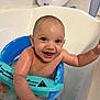 Kairo is registered to the contest to win money with this photo: baby, bathtub, water, bath_seat, smiling, child, splashing, happy, skin, droplets, blue, teal, arm, hand, bathroom, child_safety, infant, cute, person, toddler