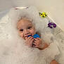 Kairo is registered to the contest to win money with this photo: toddler, bath, foam, bubbles, toy, child, water, play, fun, cute, happy, smiling, bubble_crown, bathtub, skin, hand, face, indoor, young_child, childhood