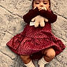 baby, child, infant, portrait, lying_down, smiling, face, plush_toy, stuffed_animal, red_dress, polka_dots, socks, blanket, fuzzy_blanket, indoor, cozy, adorable, happy, fashion, photography