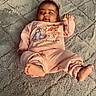 Ezra is registered to the contest to win money with this photo: baby, infant, child, portrait, lying_down, smiling, pink_outfit, onesie, winnie_the_pooh, cartoon, blanket, fuzzy_blanket, bedroom, indoor, bare_feet, toes, waving, happy, cozy, close_up