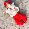 baby, child, infant, portrait, lying_down, smiling, red_headband, red_clothing, white_shirt, plush_toy, stuffed_animal, blanket, furry_blanket, indoor, fashion, casual_clothing, hand, feet, toy, photography