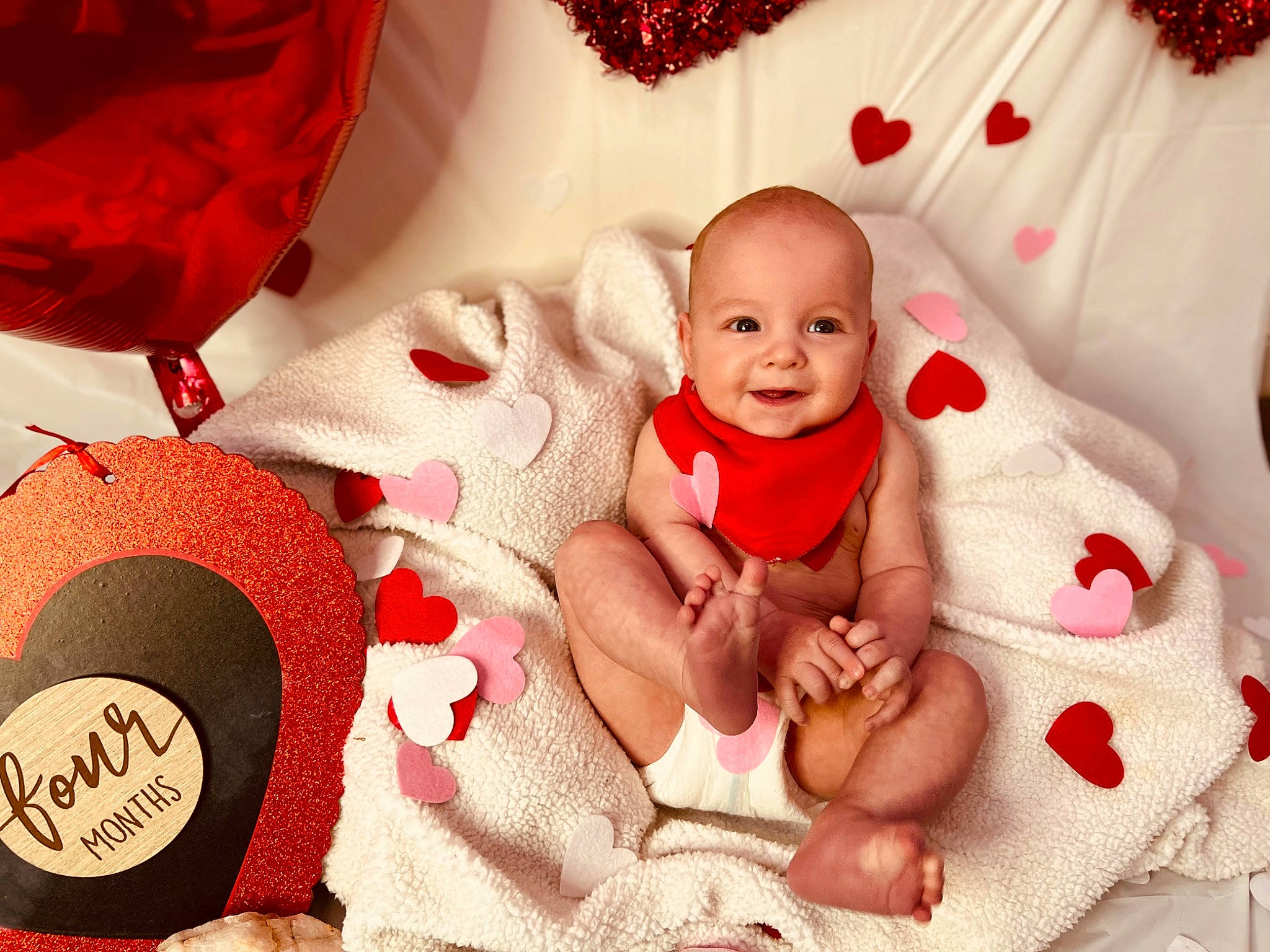 Judah is registered to the contest to win money with this photo: baby, baby_sleeping, baby_toddler_clothing, beauty, carmine, child, comfort, event, fashion_accessory, happy, headgear, holiday, joy, linens, pattern, person, pink, red, skin, smile