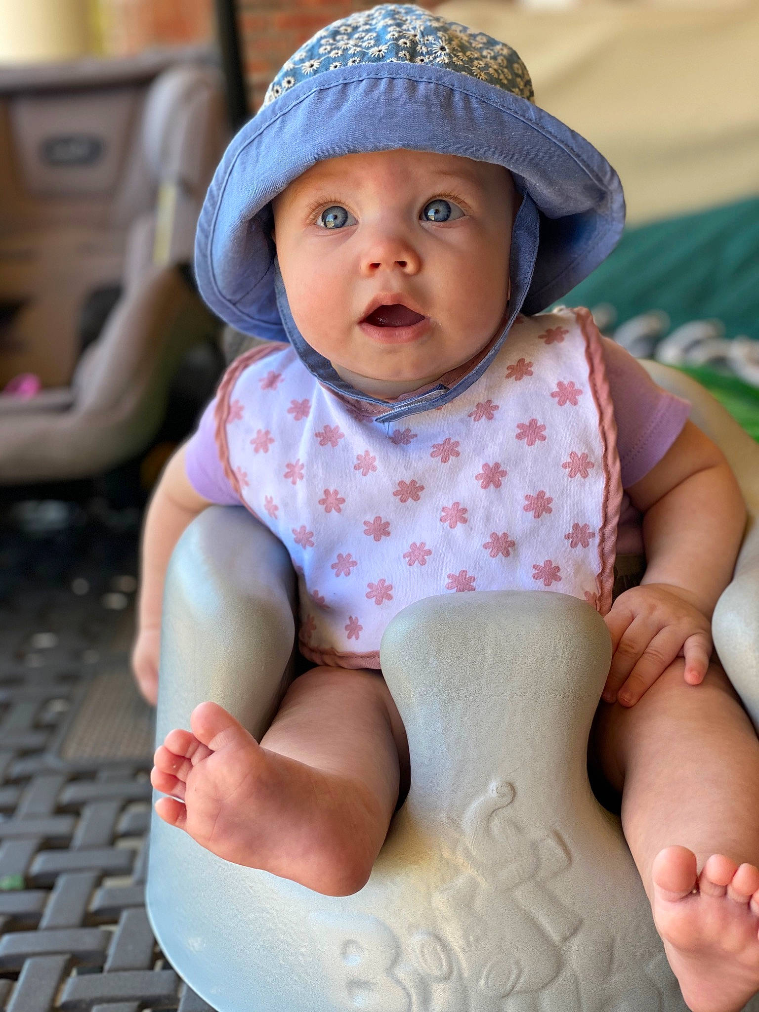 Vera is registered to the contest to win money with this photo: baby, cap, child, hat, headgear, headwear, leg, person, play, sitting, skin, sun_hat, surprise, toddler