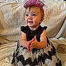 baby, birthday, birthday_girl, headband, clapping, dress, black_and_white, smiling, happy, child, one_year, celebration, indoor, blanket, portrait, cute, sitting, wooden_sign, face, person