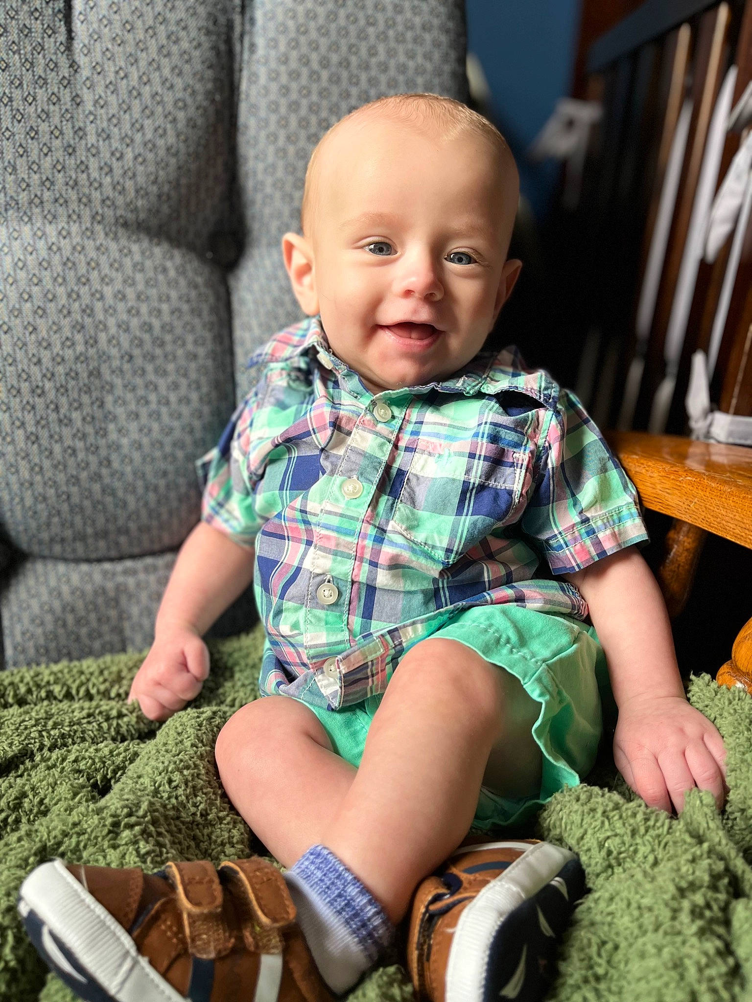 Beau joined the competition — help win amazing prizes! baby, baby_toddler_clothing, child, clothing, comfort, grass, green, leg, pattern, person, plaid, plant, sitting, skin, sleeve, smile, sock, tartan, textile, thigh