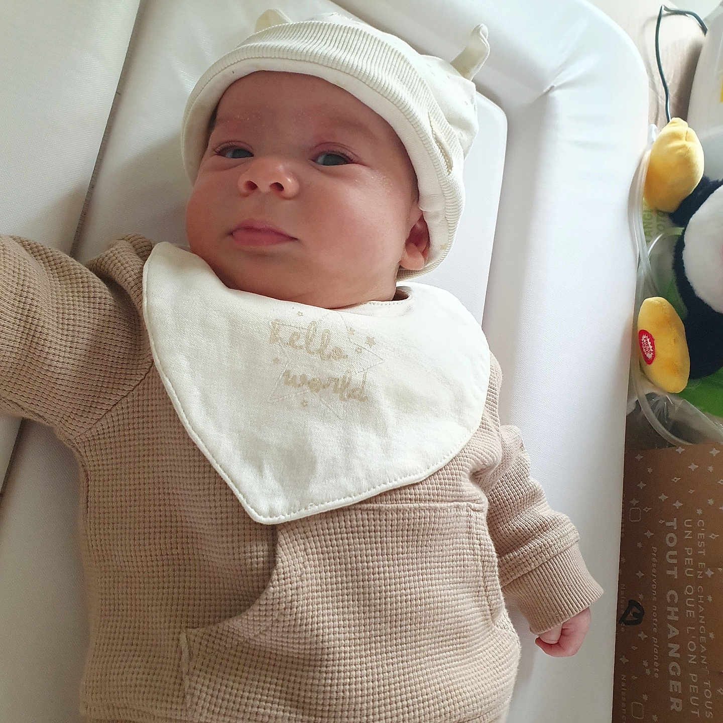 Timothé participe au concours pour gagner de l'argent avec cette photo : baby, bed, bonnet, clothing, cradle, crib, cushion, face, furniture, hat, head, homedecor, hood, infantbed, knitwear, linen, longsleeve, newborn, person, sweater