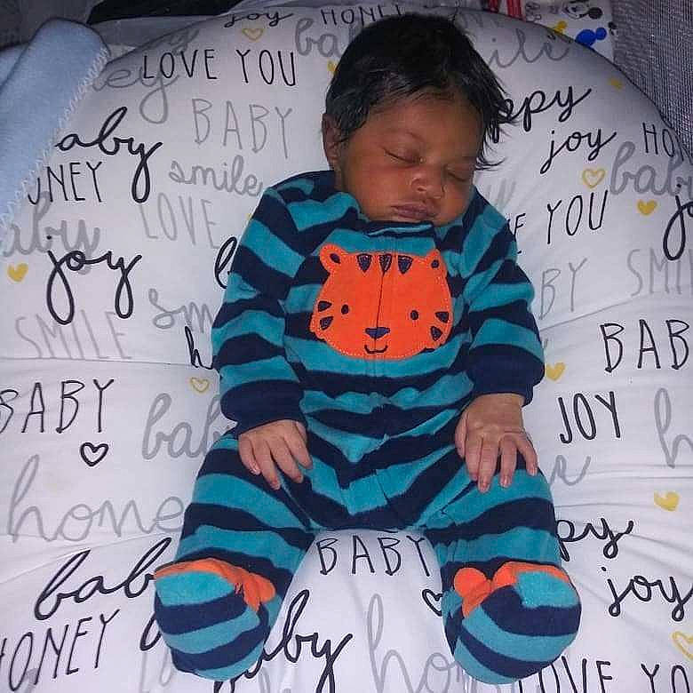 Noel is registered to the contest to win money with this photo: baby, baby_products, baby_toddler_clothing, child, cool, drawing, font, outerwear, person, product, toddler