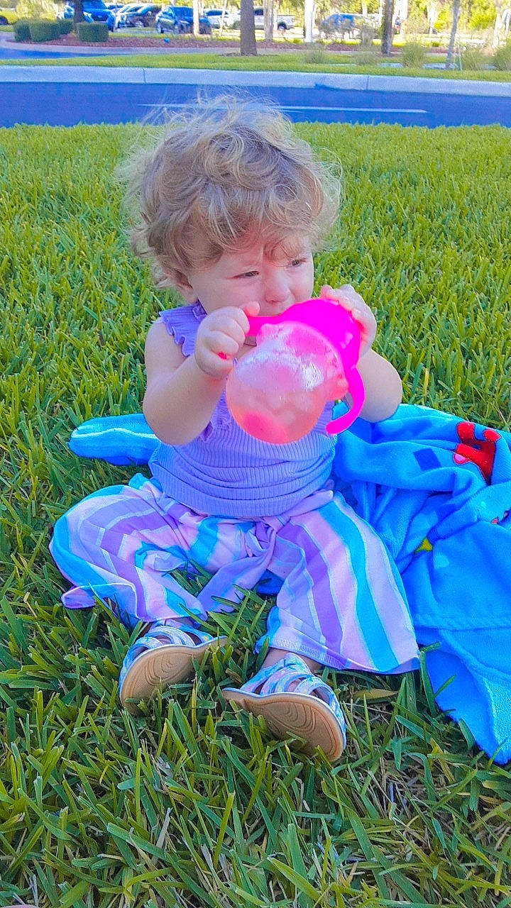 Avery is registered to the contest to win money with this photo: baby, baby_toddler_clothing, child, electric_blue, fun, grass, grass_family, grassland, happy, lawn, leisure, liquid_bubble, meadow, people_in_nature, person, plant, recreation, sitting, sunlight, toddler