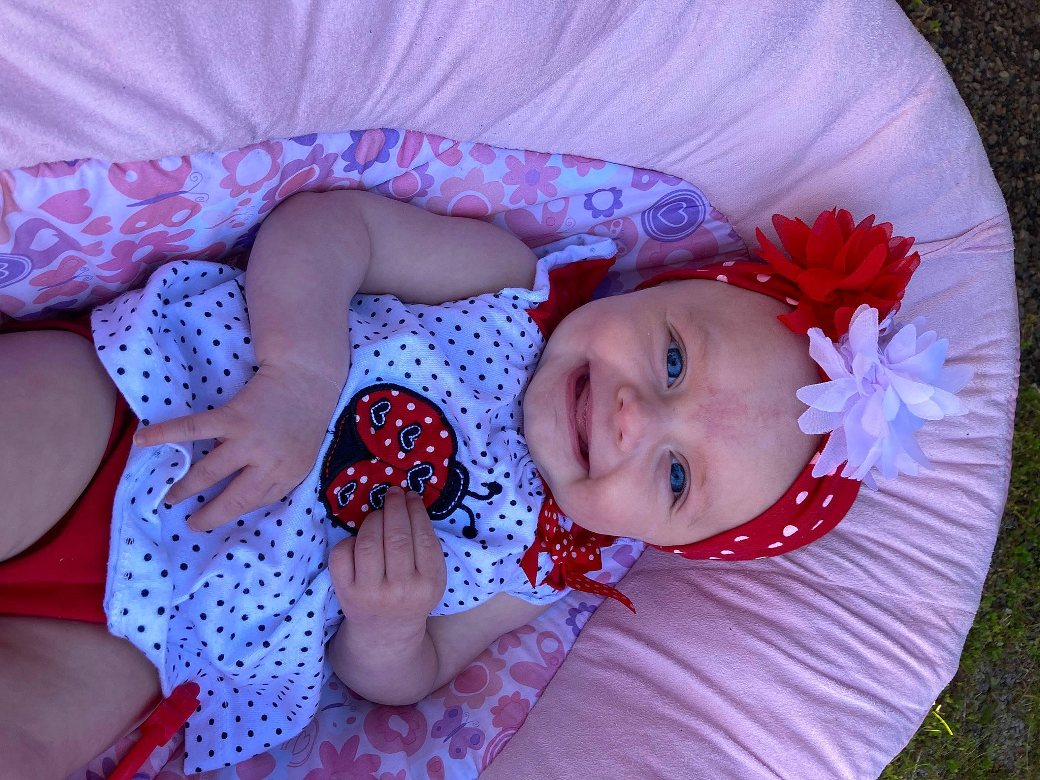 Zaylin joined the competition — help win amazing prizes! baby, baby_toddler_clothing, dress, eye, facial_expression, hand, happy, headgear, headwear, human_body, iris, joy, lip, mouth, person, pink, plant, product, purple, red