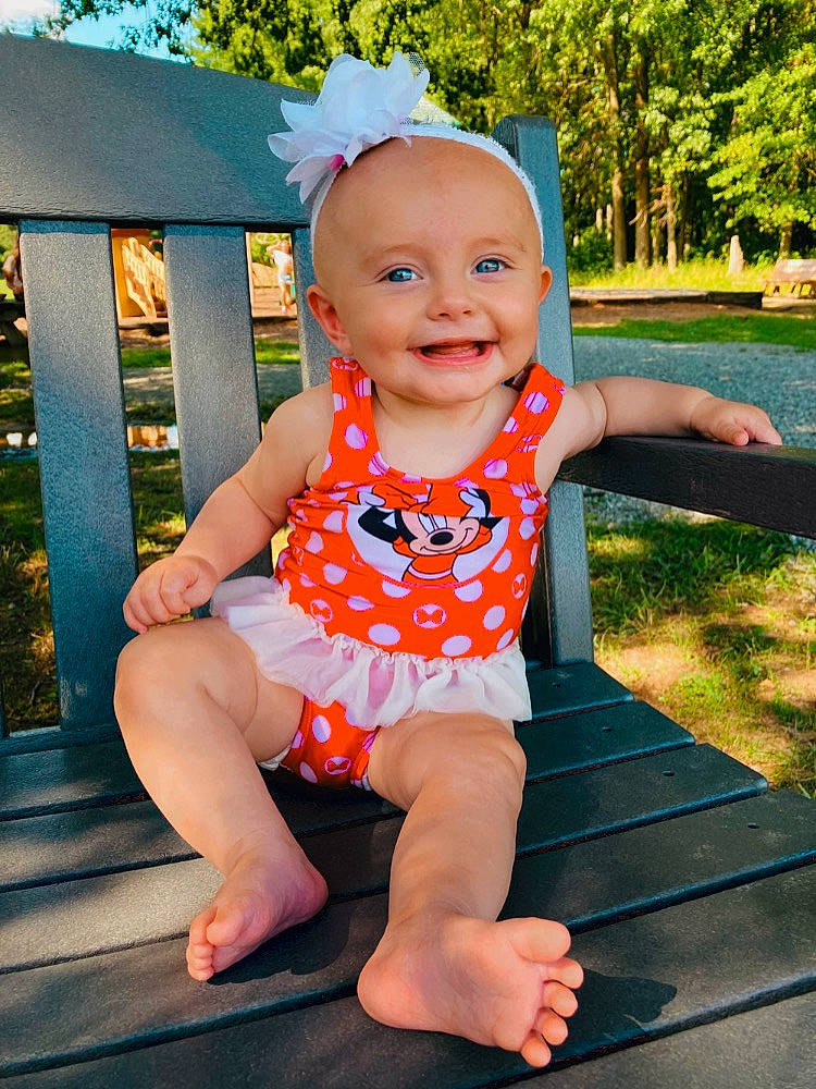 Zaylin joined the competition — help win amazing prizes! baby, baby_toddler_clothing, barefoot, child, face, foot, fun, grass, happy, human_leg, joy, leisure, pattern, person, pink, plant, recreation, sitting, sleeve, smile