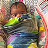 Iris is registered to the contest to win money with this photo: baby, bed, blanket, couch, cradle, crib, cushion, face, furniture, head, homedecor, infantbed, laundry, newborn, person, photography, portrait, quilt, sleeping, towel