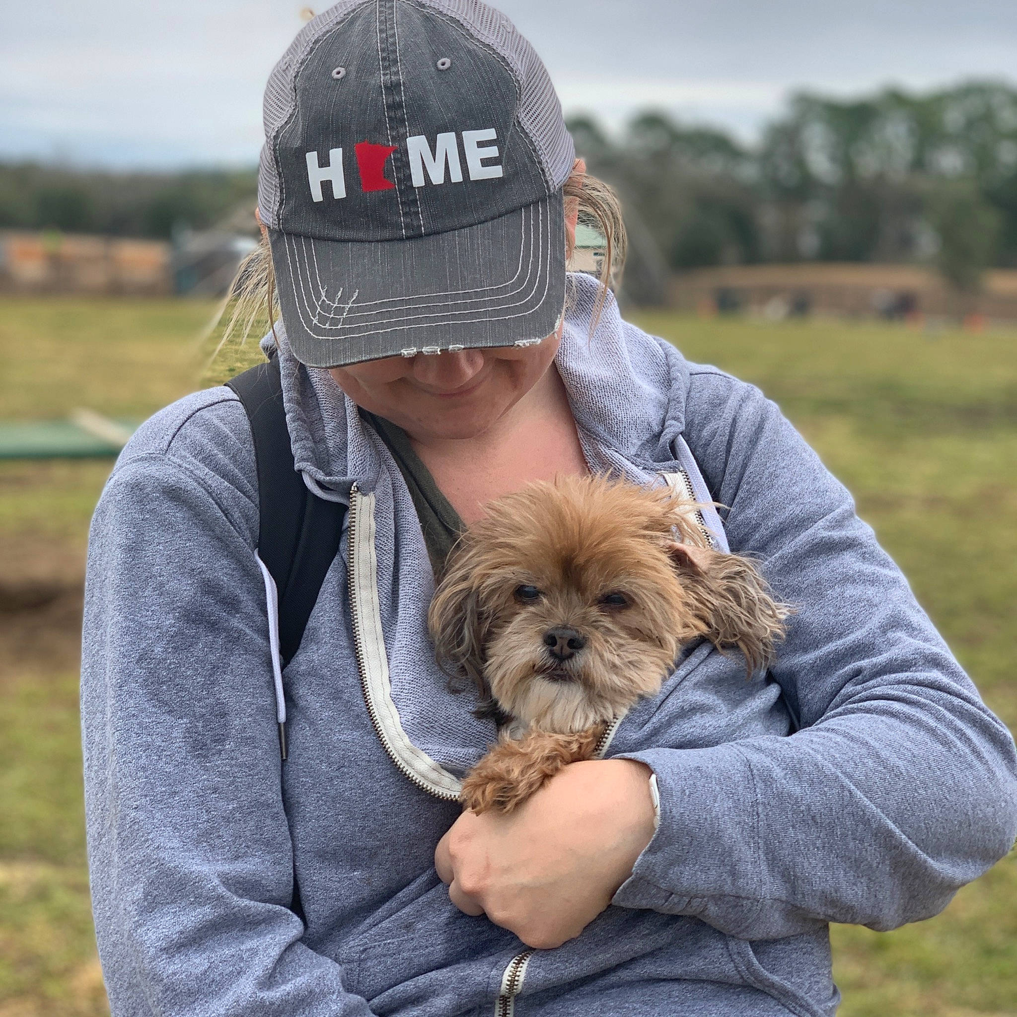 Peanut joined the competition — help win amazing prizes! baseball_cap, beard, canidae, cap, carnivore, clothing, companion_dog, dog, dog_breed, fawn, fur, grass, griffon_bruxellois, happy, sky, small_terrier, sporting_group, terrier, toy_dog, tree