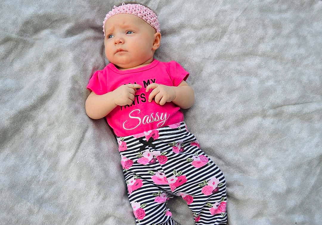 Deanna joined the competition — help win amazing prizes! baby, baby_products, baby_toddler_clothing, child, clothing, headwear, pajamas, pattern, person, pink, product, sleeve, toddler