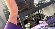 Nimbus is registered to the contest to win money with this photo: black_cat, can, cat, closeup, computer_accessory, content, cozy, desk, face, feline, hand, home_office, indoor, mousepad, pens, pet, purple_sleeve, resting, sleepy, whiskers