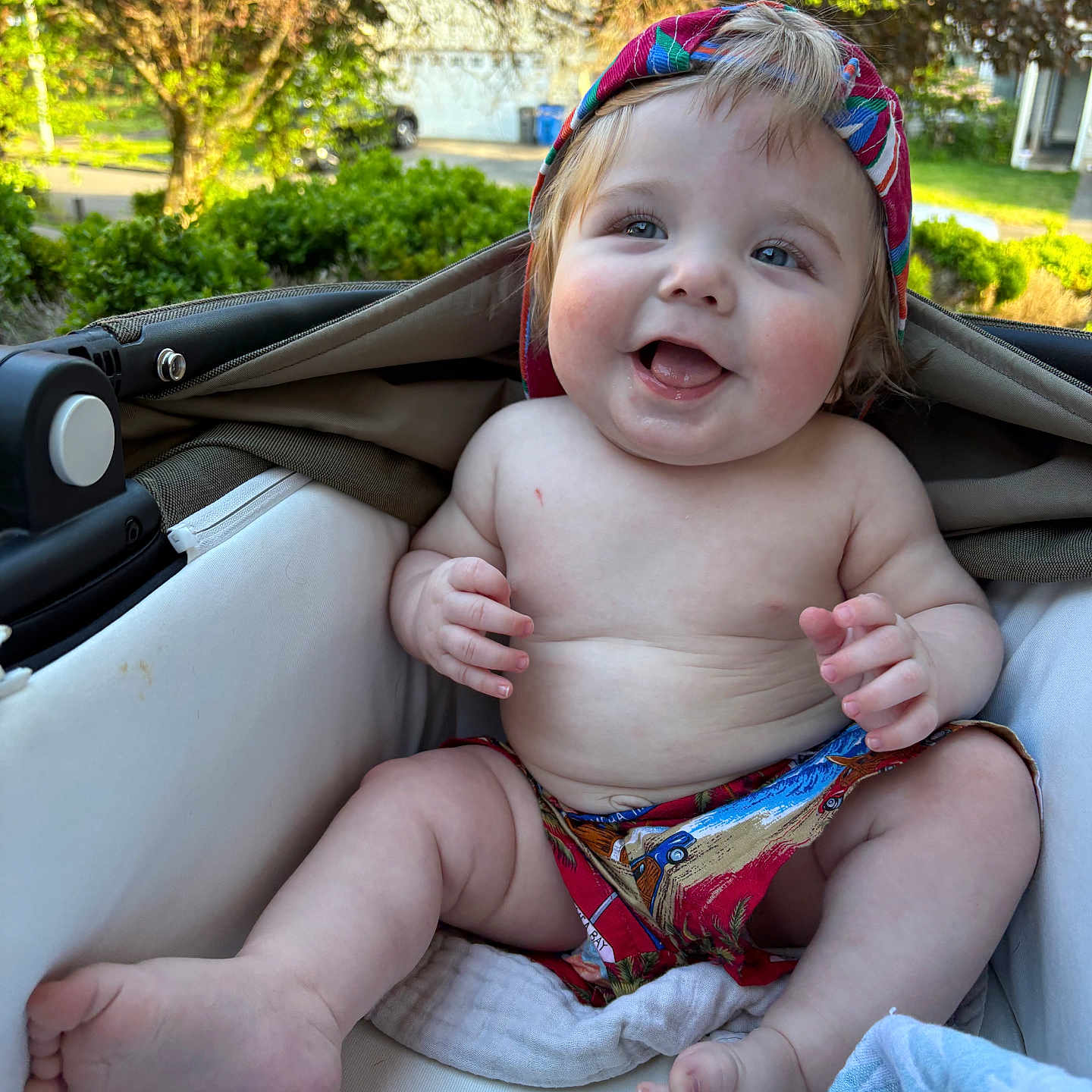 Lucky joined the competition — help win amazing prizes! baby, bare_chest, blanket, cap, child, cute, daylight, fabric, feet, greenery, hand, happy, infant, legs, nature, outdoor, skin, smiling, stroller, sunlight