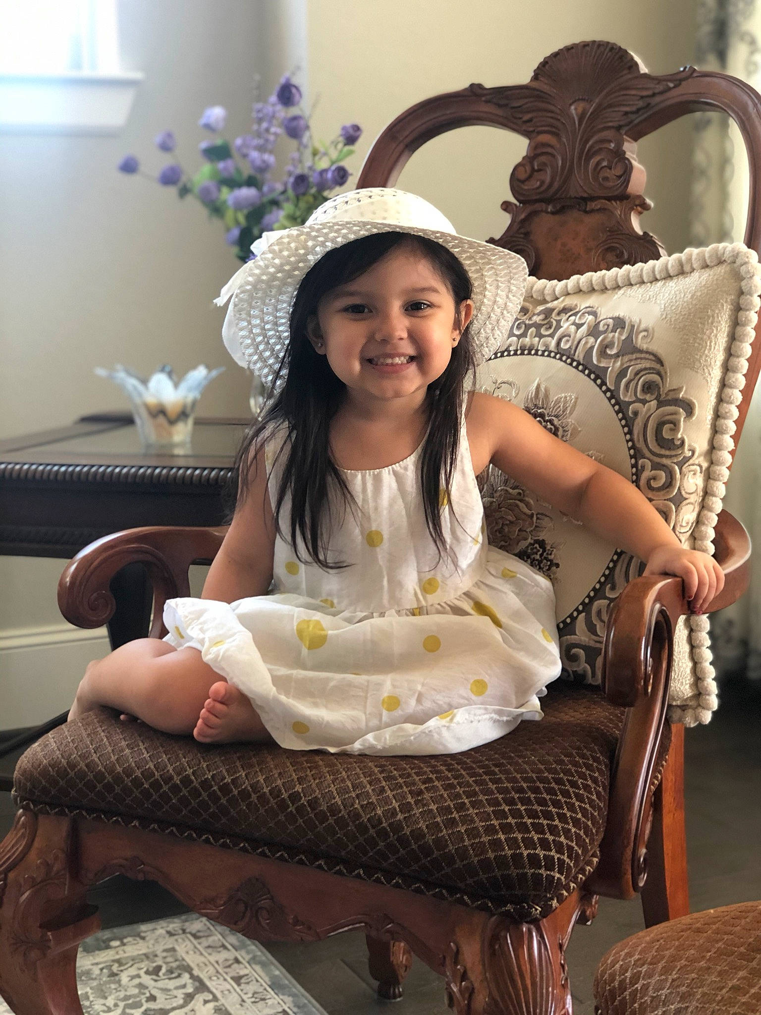 Scarlette is registered to the contest to win money with this photo: chair, child, furniture, headwear, joy, person, sitting, smile