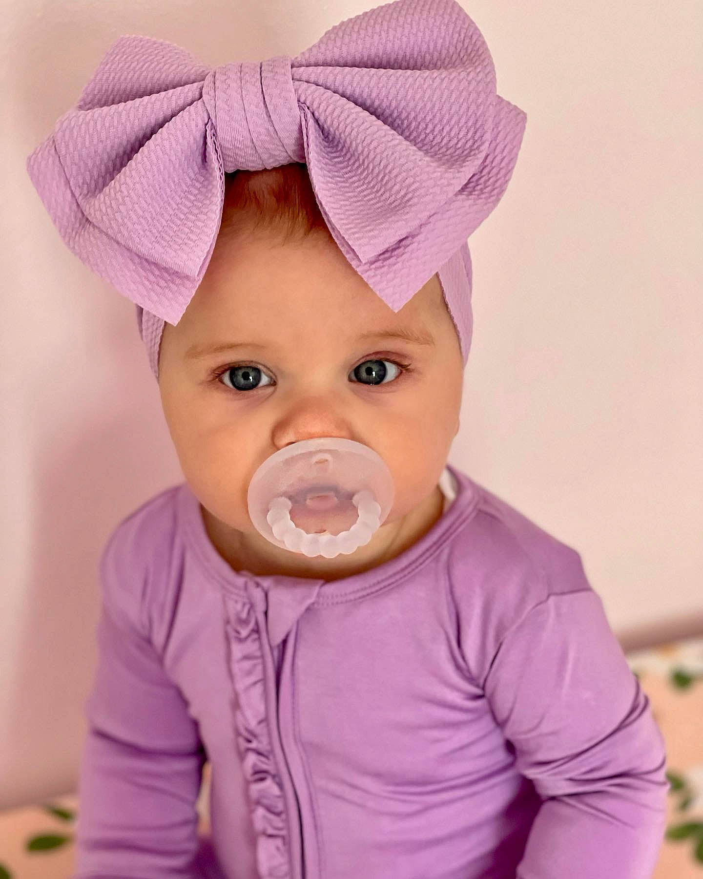 Gemma joined the competition — help win amazing prizes! baby, cap, cheek, chin, clothing, eyebrow, eyelash, facial_expression, happy, headwear, lip, neck, nose, outerwear, person, pink, purple, skin, sleeve, textile