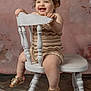 Kimberly joined the competition — help win amazing prizes! toddler, child, smiling, curly_hair, headband, knitted_clothing, chair, white_chair, sitting, happy, portrait, indoors, floor, footwear, sandal, cute, baby, skin, expression, background