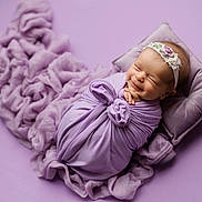 Margot joined the competition — help win amazing prizes! newborn, baby, infant, wrapped, purple, lavender, headband, smiling, sleeping, pillow, fabric, soft, cute, portrait, studio, child, peaceful, blanket, closeup, resting