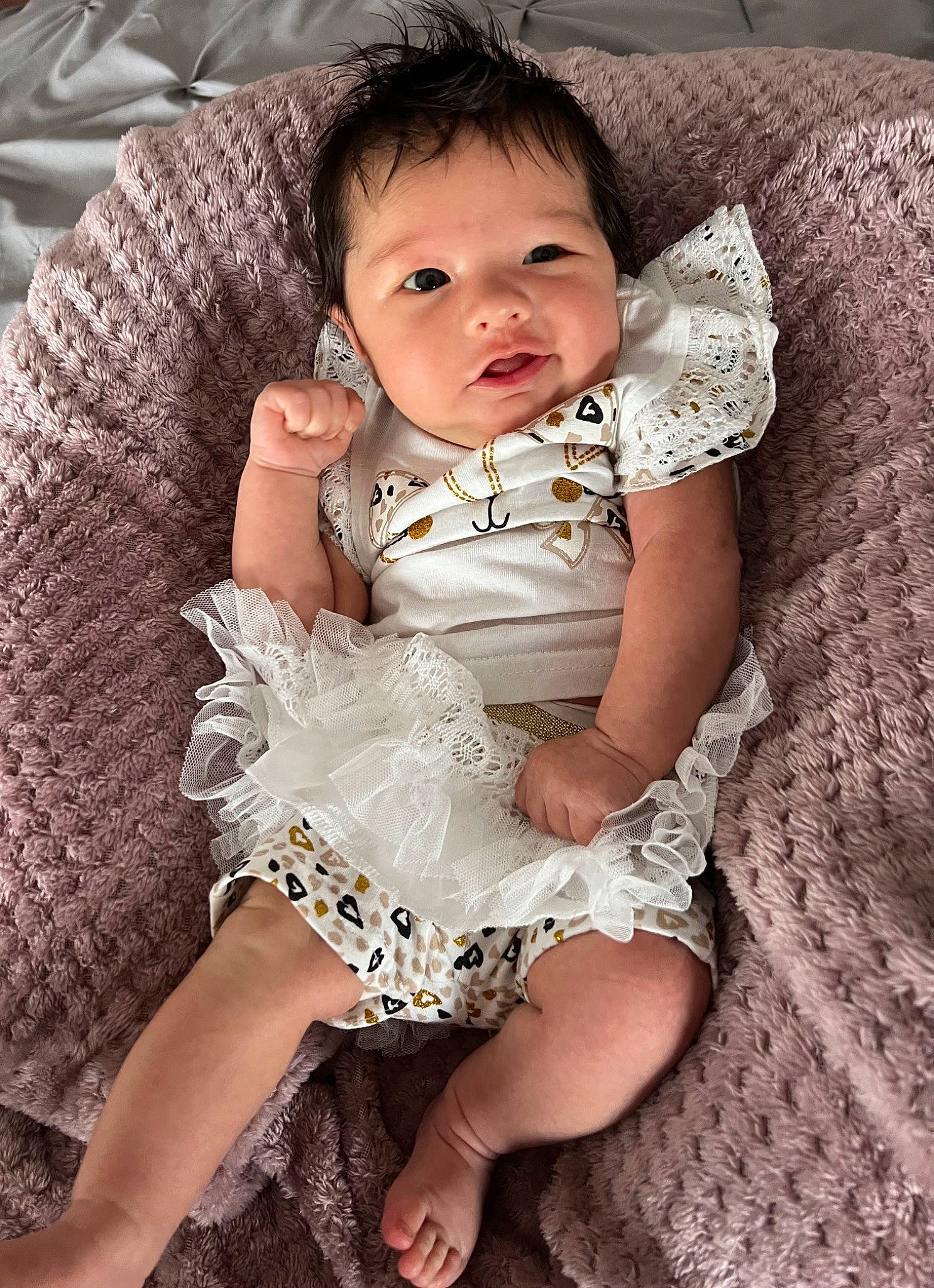 Cora is registered to the contest to win money with this photo: arm, baby, baby_toddler_clothing, cheek, eye, face, finger, flash_photography, hair, hand, head, human_body, iris, lip, neck, person, shoulder, skin, sleeve, textile