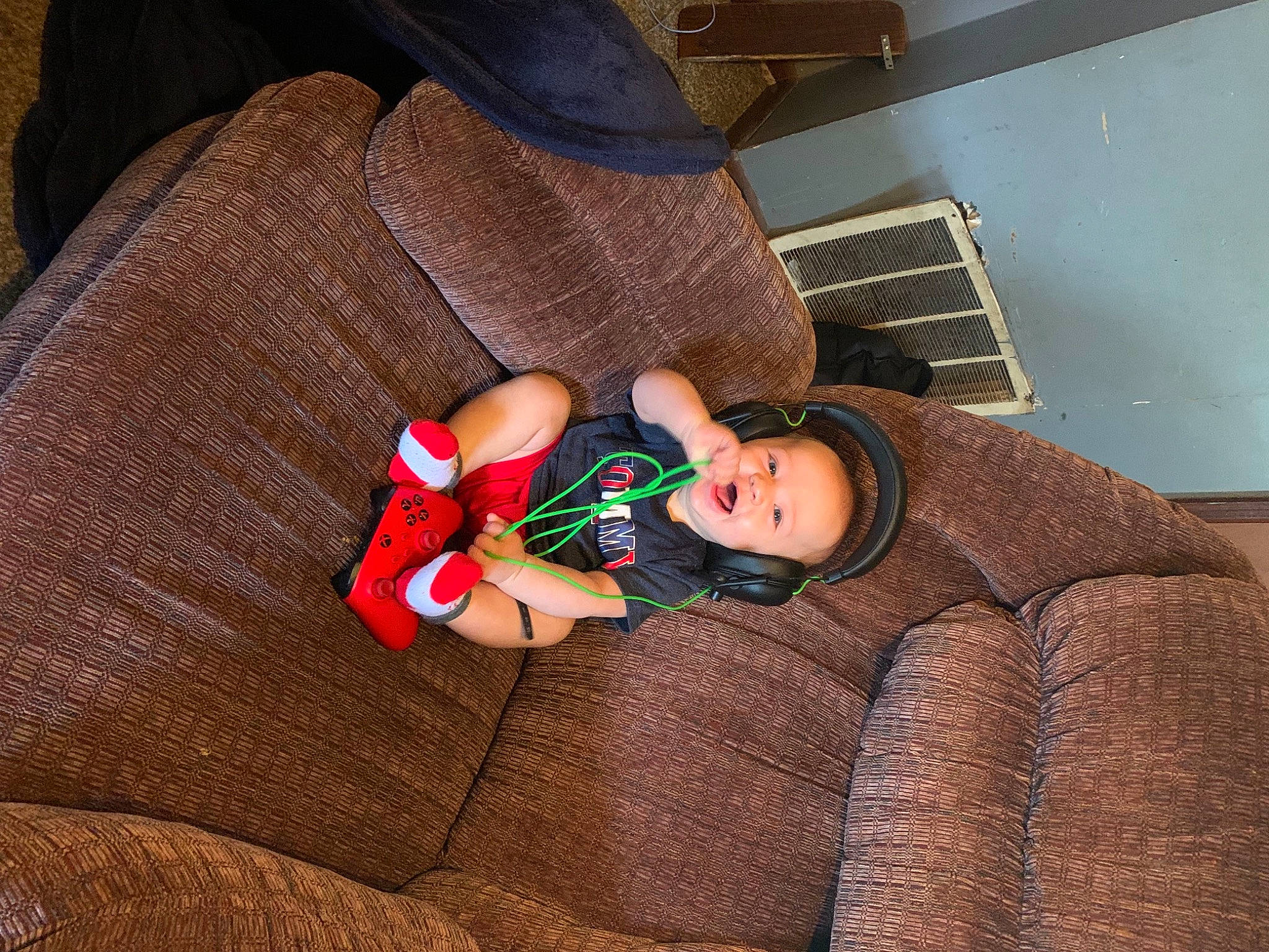 Dezmond joined the competition — help win amazing prizes! baby, baby_toddler_clothing, comfort, couch, flooring, foot, hat, human_body, human_leg, knee, lap, leg, linens, person, room, sitting, sleeve, sock, thigh, toddler