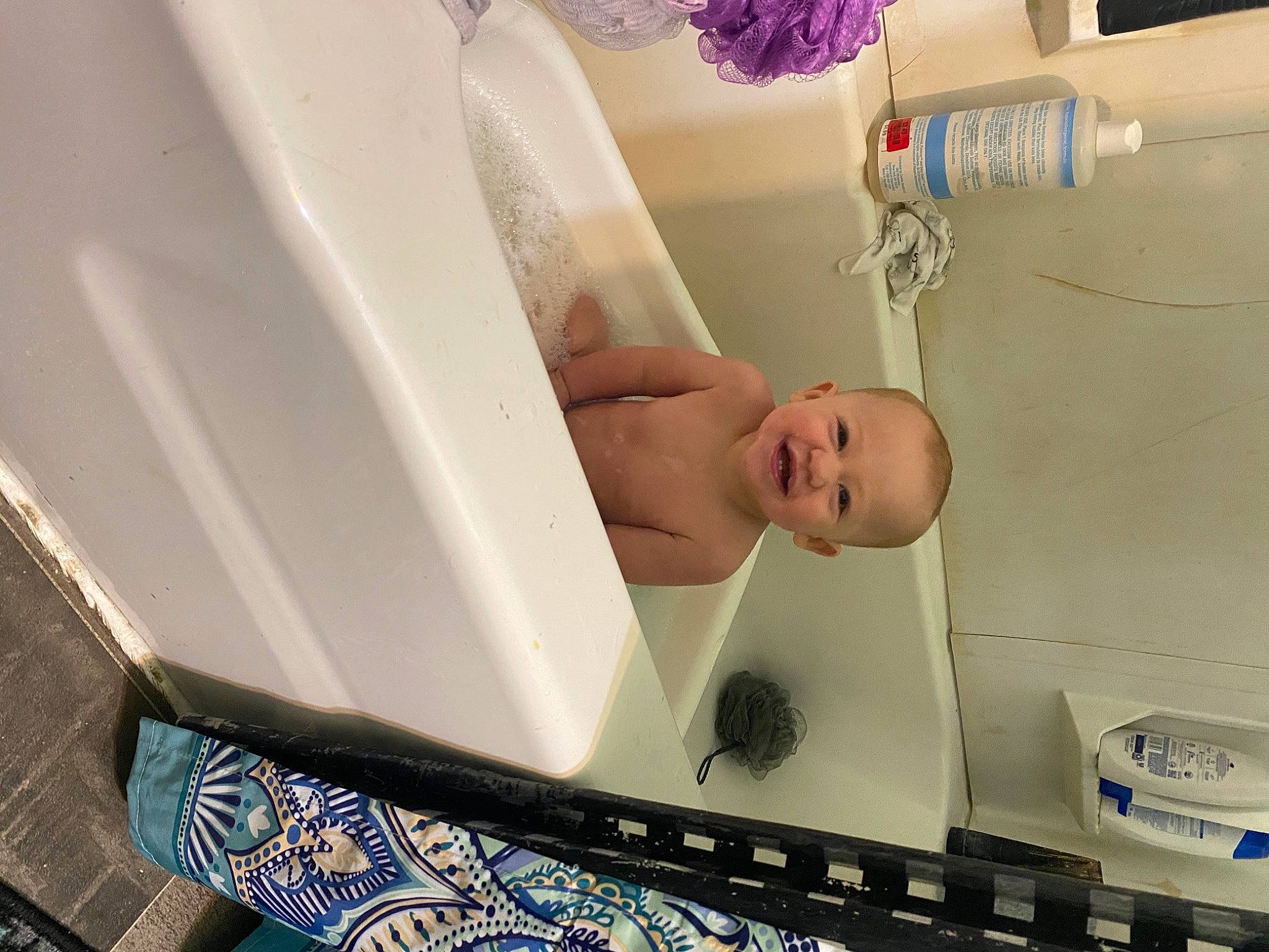 Dezmond is registered to the contest to win money with this photo: arm, baby, baby_safety, bathing, bathroom, bathtub, ceiling, chest, child, comfort, flooring, health_care, hospital, joy, pattern, person, plumbing, plumbing_fixture, room, service